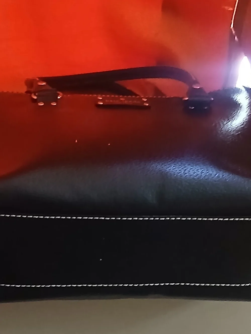 kate spade black leather satchel with polka-dot interior